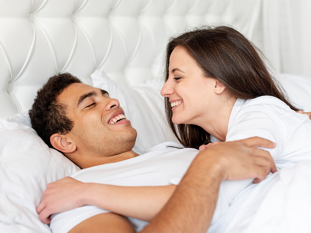 happy-couple-laying-in-bed-erektus-remedies-international